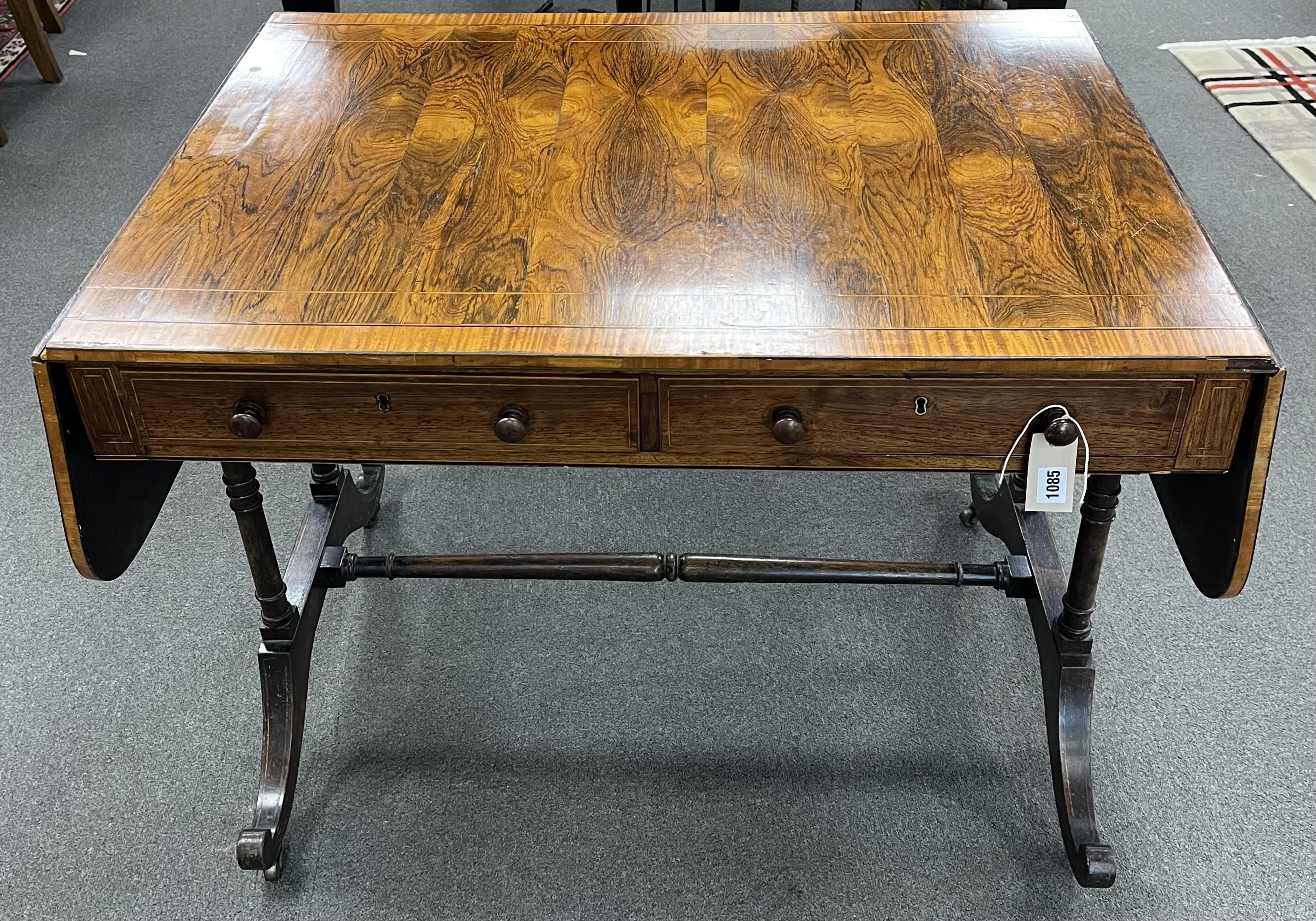 A Regency satinwood banded rosewood sofa table, width 92cm, depth 66cm, height 71cm. Condition - fair